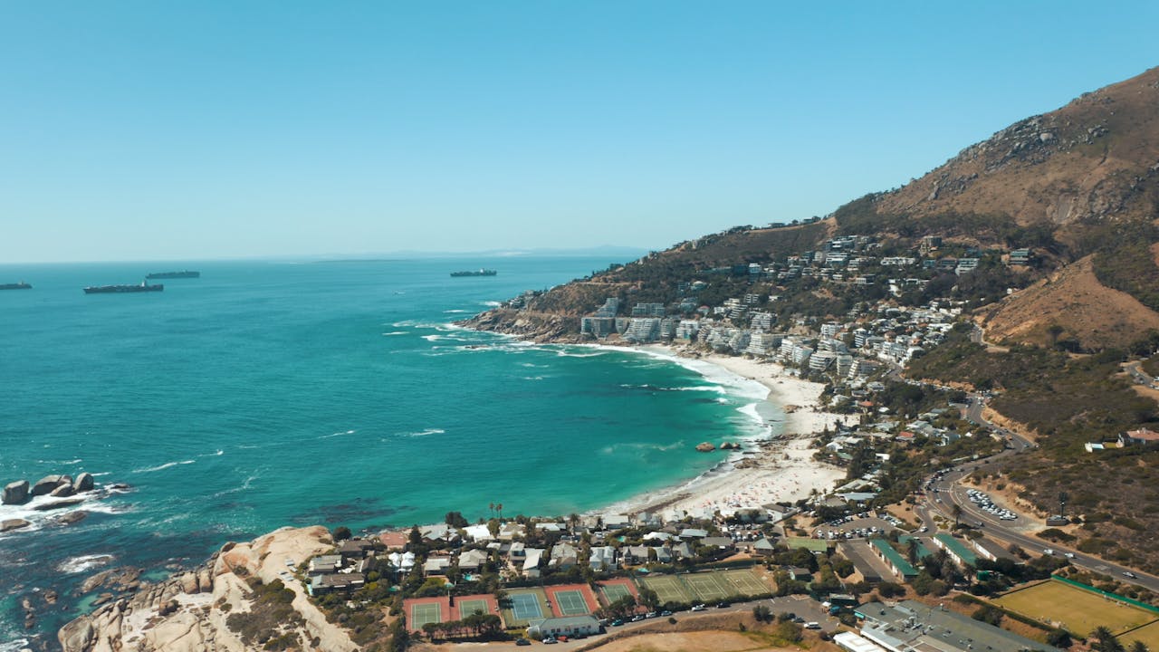 Explore the stunning aerial view of Cape Town's pristine beaches and turquoise waters.