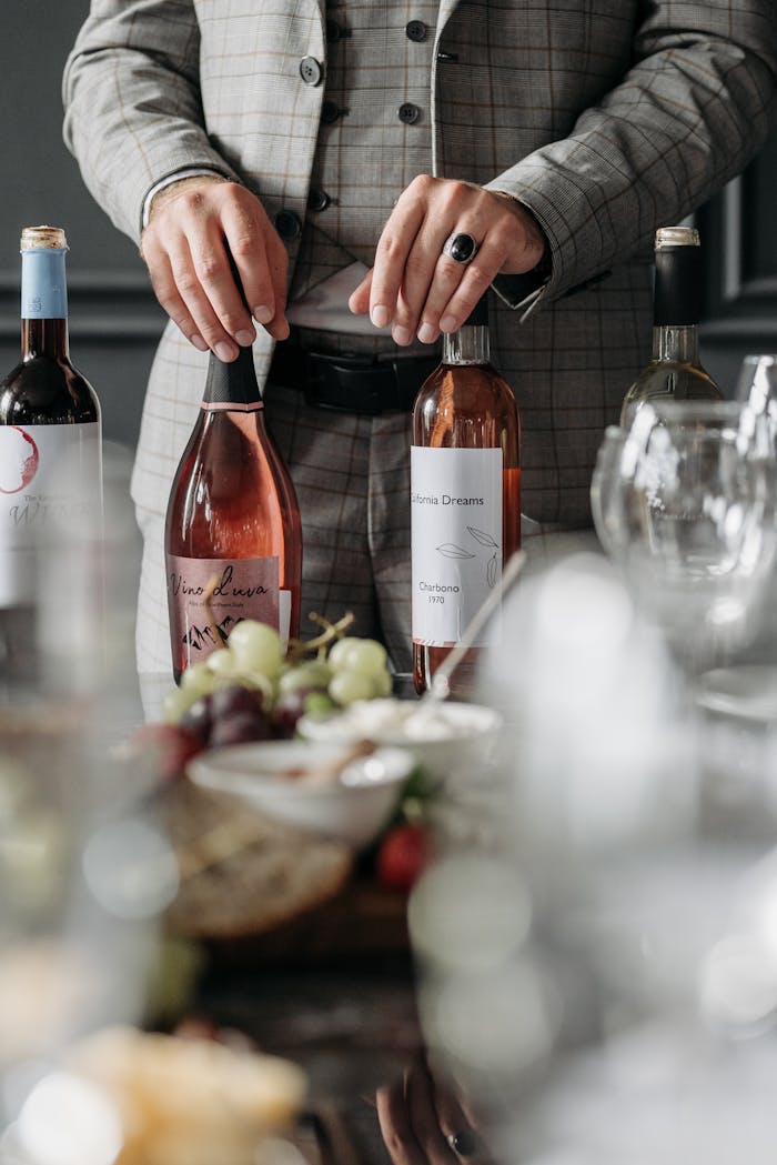 A sommelier setting up for a sophisticated wine tasting party indoors.